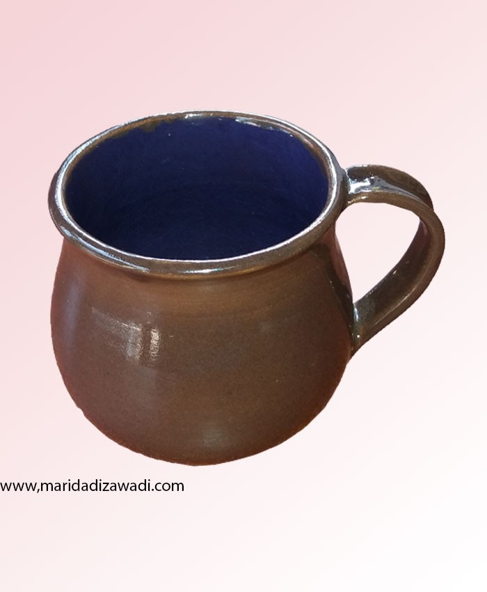 brown mug with grape blue inside